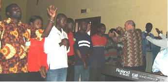 Laying hands on the workers in the seminar.