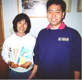 Maki with her husband Michi. She is holding the text books for Japanese 