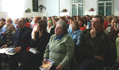 The students listen intently taking notes of the teaching.