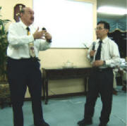 Tony Abram preaches and Aoki sensei looks on 